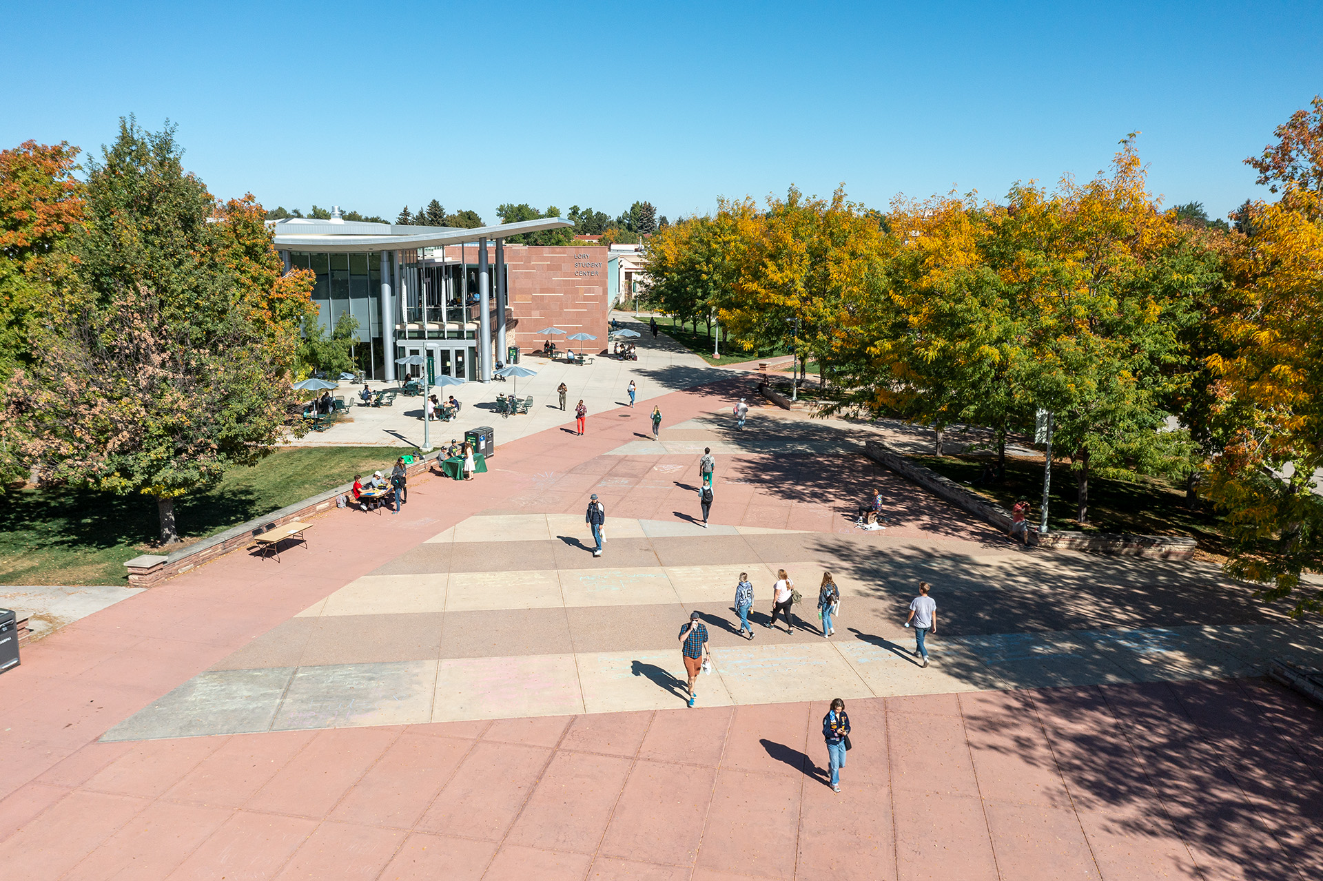 Students enjoy sunny weather on the Lory Student Center Plaza on the Colorado State University campus, October 4, 2021.